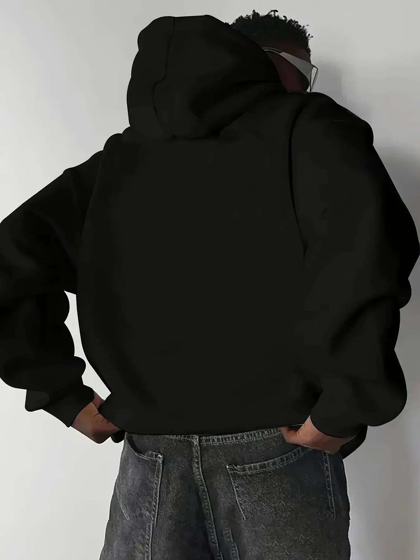 A Male Marvel Punisher with A Skull Print Effect Design Wearing A 100% Cotton Casual Hooded Sweatshirt on The Street