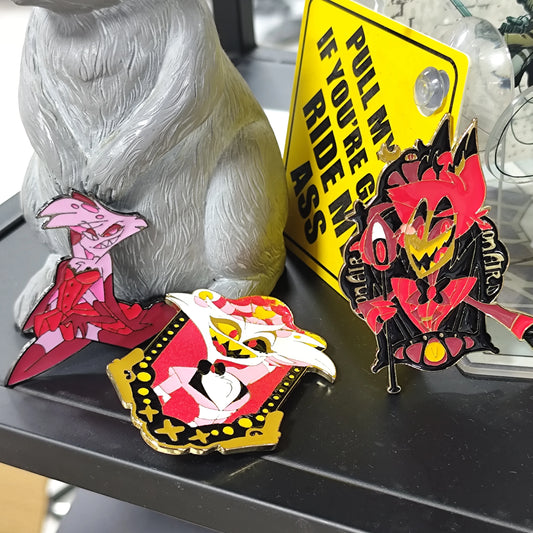 Three enamel pins with unique cartoon characters. Bright colors, detailed designs. Ideal for decorating bags/clothes.